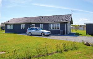 a car parked in front of a house at Holiday Home Pilemose Sydals in Skovby