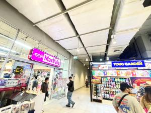 a group of people walking inside of a store at Lovely Impact C3-C9 Lily in Nonthaburi