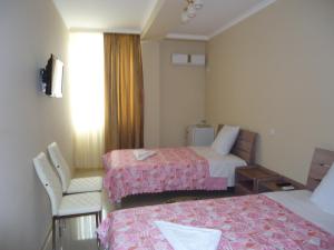 Hotel Okriba客房内的一张或多张床位
