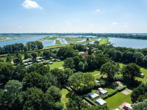an aerial view of a park next to a lake at Premium bungalow 6 persons in Zevenhuizen