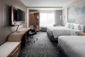 Katil atau katil-katil dalam bilik di Courtyard by Marriott Pullman
