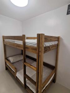 a set of bunk beds in a room at 2 BR Condo at Camella Manors Palawan in Puerto Princesa City