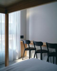 A bed or beds in a room at da Haus Shinjuku