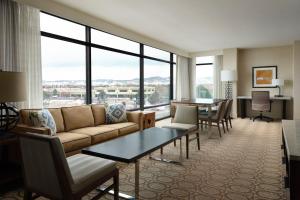 a living room with a couch and a table at Denver Marriott Westminster in Westminster
