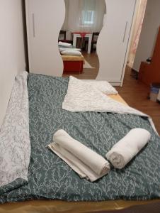 a bed with two white pillows on top of it at Nataly Apartment in Belgrade
