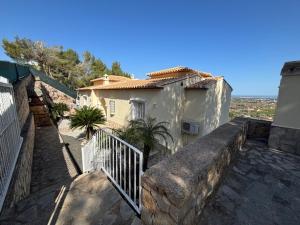 a house with a staircase next to a building at Casa Vista Bonita in Pedreguer