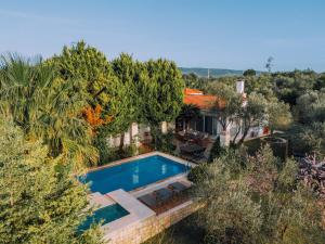 an aerial view of a house with a swimming pool at Bir Dem Urla in Urla
