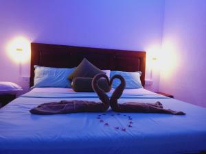Voodi või voodid majutusasutuse White Villa Hotel toas