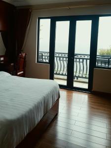 Postel nebo postele na pokoji v ubytování Discovery Hotel