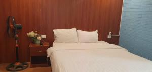 Postel nebo postele na pokoji v ubytování Discovery Hotel