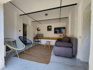 a living room with a couch and a table at Domek pod Klonem in Lubliniec