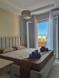 Ένα ή περισσότερα κρεβάτια σε δωμάτιο στο Golden View Suites +45 φωτογραφίες