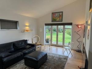 Et opholdsområde på Weybridge garden cottage