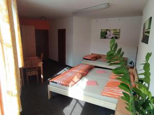 Postel nebo postele na pokoji v ubytování Penzion a restaurace U Pošů