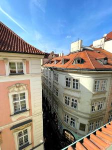 an overhead view of buildings with red roofs at Kristian's Old Town Sq. Apartments in Prague