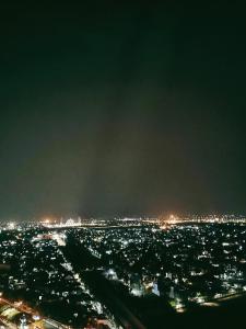 a view of a city at night with lights at Inapin Aja by Dio Property in Bandung