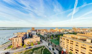 an aerial view of a city and the water at Amadi Panorama Hotel in Amsterdam