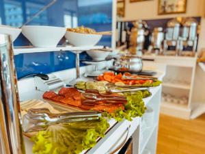 a buffet line with many different types of food at Batumi High View in Batumi