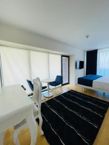 Posteľ alebo postele v izbe v ubytovaní Batumi High View