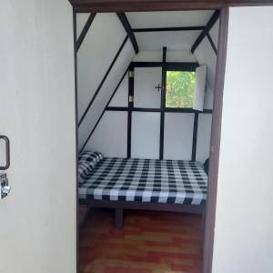 a bed in a room with a window at 3B Beach Resort Alegria in Santa Monica