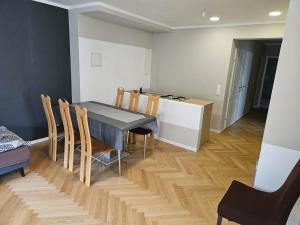 a kitchen and dining room with a table and chairs at GardenLoft no1 in Vienna +20 photos