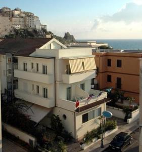 a large building with a view of the ocean at Hotel Mayor in Sperlonga