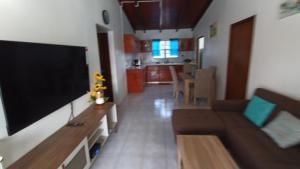 a living room with a large flat screen tv at villa nikiboko Bonaire in Kralendijk