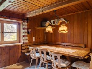 a dining room with a wooden table and chairs at Peaceful Apartment in Rauris near Ski Area Zell am See in Rauris