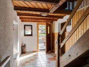 a hallway of a house with a wooden ceiling at Peaceful Apartment in Rauris near Ski Area Zell am See in Rauris