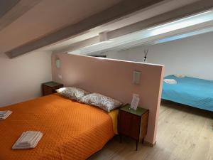 Letto o letti in una camera di La Buca delle Fate Ristorante Albergo