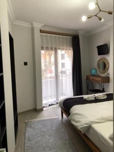 Postel nebo postele na pokoji v ubytování Valeria House