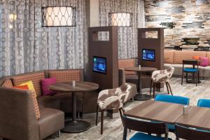 a dining room with tables and chairs and tablesktop at Courtyard by Marriott Fort Worth Historic Stockyards in Fort Worth