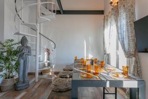 a dining room with a table with food on it at DUPLEX TEMPLO NEVADO con 2 Parking cubiertos gratis in Sierra Nevada