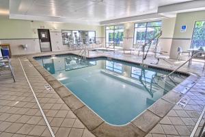 a large swimming pool in a hotel room at SpringHill Suites Detroit Southfield in Southfield