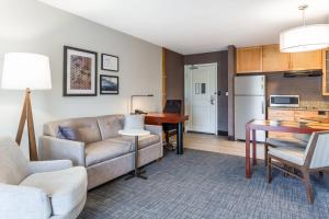 a living room with a couch and a table at Residence Inn Duluth in Duluth