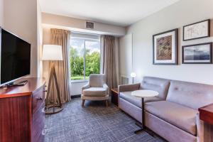 a living room with a couch and a tv at Residence Inn Duluth in Duluth