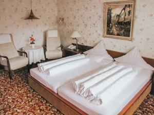 Postel nebo postele na pokoji v ubytování Hotel Harzer am Kurpark