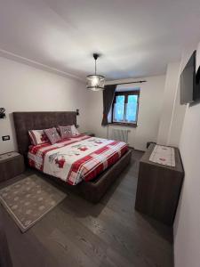 A bed or beds in a room at Dolomites Holiday Home