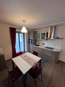 A kitchen or kitchenette at Dolomites Holiday Home