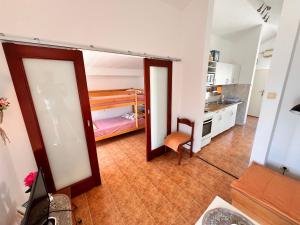 a kitchen with a door open to a room at Apartments LIDO Petrovac in Petrovac na Moru