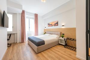 Кровать или кровати в номере Binario Verticale