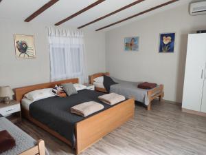 a bedroom with two beds in a room at Villa SUNFLOWER in Mostar +26 photos