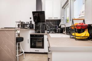 a kitchen with a dish rack with fruit in it at Magical Brand New Suite in Zipárion +21 photos