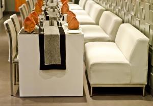a long table with chairs and food on it at The Opal in Rāmpur
