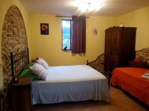 a bedroom with a bed and a window at Bed and Breakfast della Regina... in Fondi +21 photos