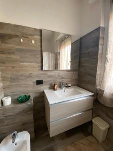 a bathroom with a sink and a toilet at Sole , Neve e Relax in Clusone