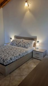 Postel nebo postele na pokoji v ubytování Agriturismo Pastorelli