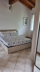 Postel nebo postele na pokoji v ubytování Agriturismo Pastorelli