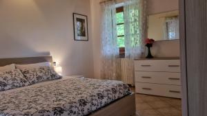 Postel nebo postele na pokoji v ubytování Agriturismo Pastorelli