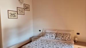 Postel nebo postele na pokoji v ubytování Agriturismo Pastorelli